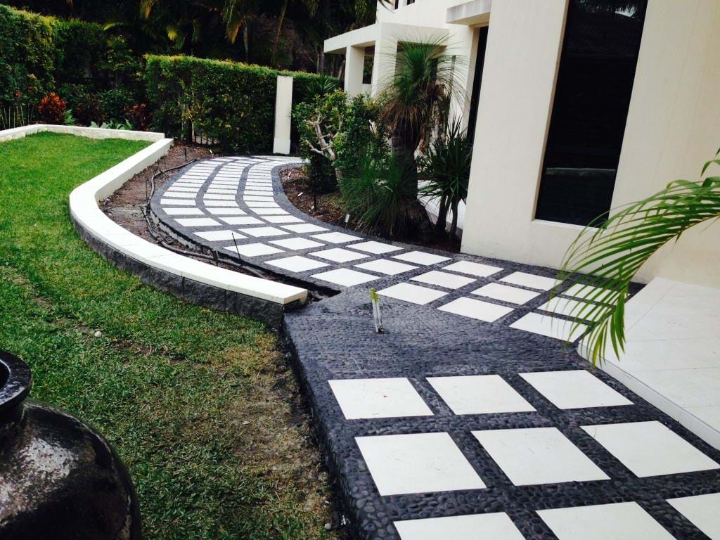 Ceramic tiles with black pebble surrounds